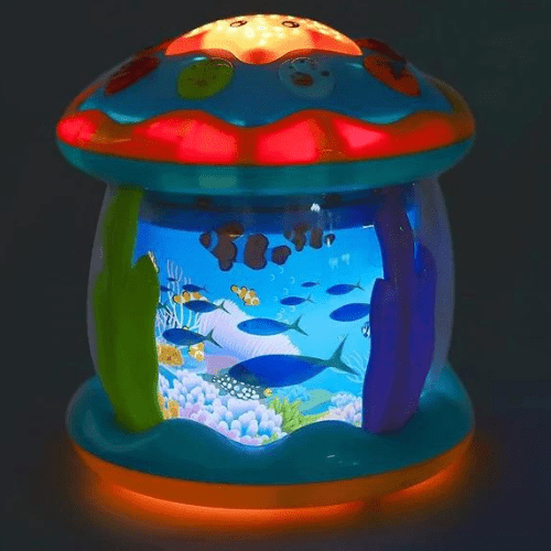 Projecteur ciel étoilé océan pour chambre bébé avec projections lumineuses de poissons et étoiles apaisantes.