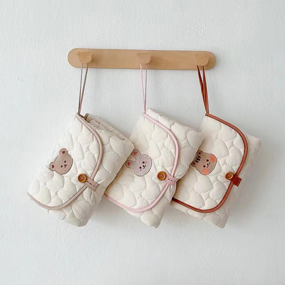 Matelas à langer pliable et nomade pour bébé