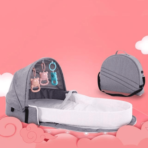 Réducteur de lit bébé pliable BestBabyMosquito™ avec moustiquaire, jouets intégrés et transport facile, cocon confortable et sécurisé pour nouveau-nés.
