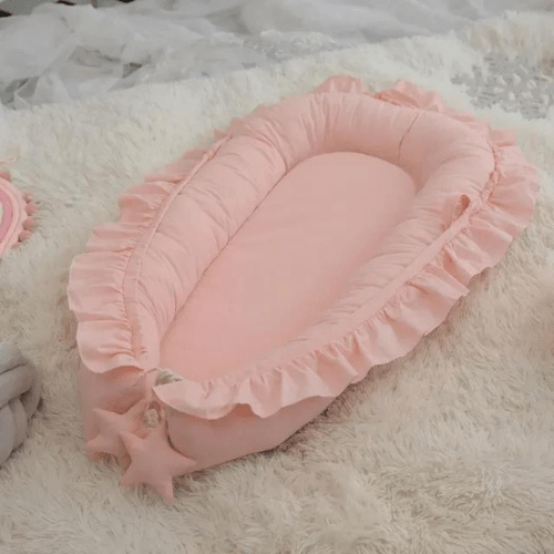 Nid de cocon bébé rose doux et rembourré pour sommeil sécurisé et confortable des nourrissons