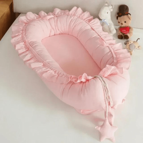 Nid de Cocon Bébé rose douillet et sécurisé pour nouveau-nés et nourrissons, portable et confortable.