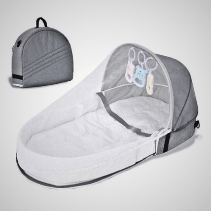 Réducteur de lit bébé BestBabyMosquito™ gris avec filet anti-insectes et jouets intégrés, pliable et portable avec sac de transport.
