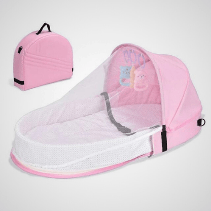 Réducteur de lit bébé rose BestBabyMosquito™ avec filet anti-insectes et jouets intégrés, portable et confortable pour nouveau-nés.