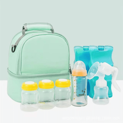Sac à langer vert clair avec compartiment biberon, bouteilles, tire-lait et packs de glace pour garder le lait maternel frais.