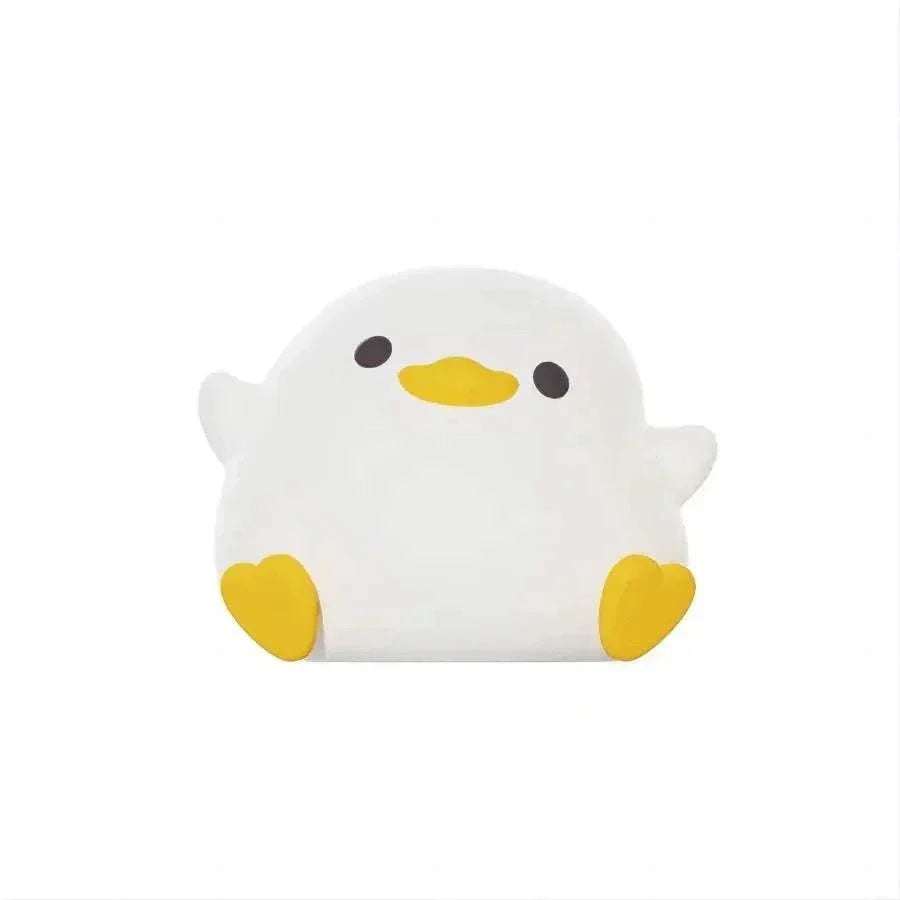 Veilleuse bébé-blanche en forme de canard, lumière douce et apaisante pour enfants, design en silicone sûr et tactile.