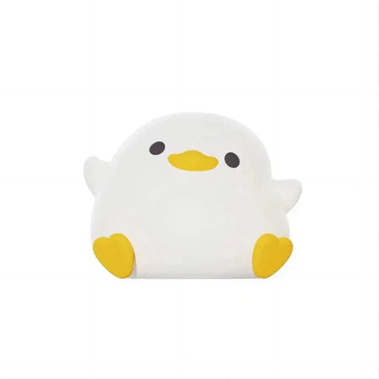 Veilleuse bébé-blanche en forme de canard, lumière douce et apaisante pour enfants, design en silicone sûr et tactile.